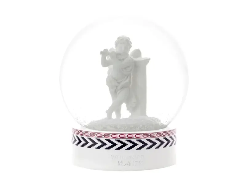 White statue inside a transparent dome with a decorative base on a white background