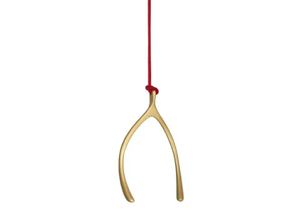 Gold wishbone Ornaments on a red string against a white background