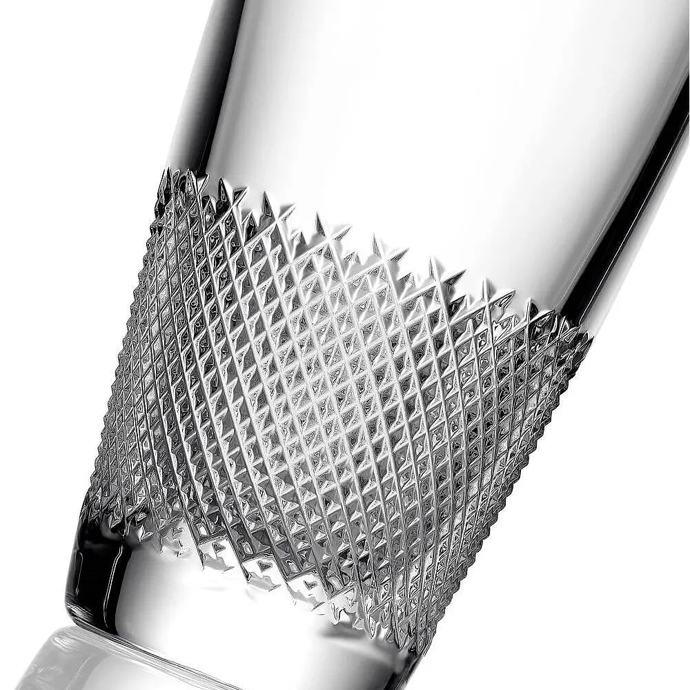 A close-up of a clear glass tumbler with a textured, diamond-cut metallic band around the lower half, set against a clean white background.