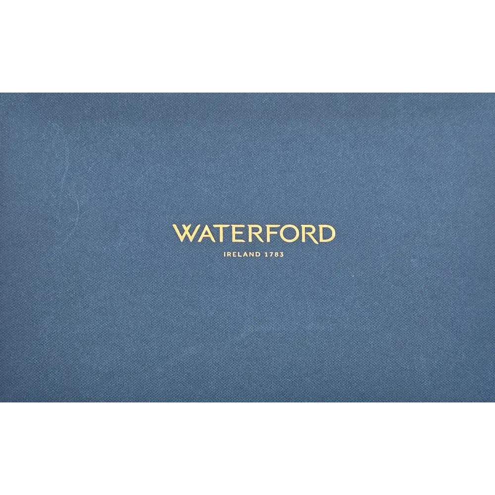 Blue surface with 'Waterford' branding in gold text