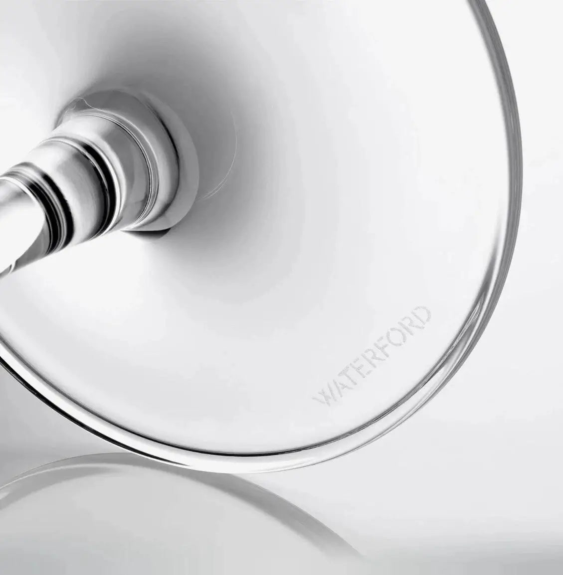 Close-up of a glass lid with a silver handle