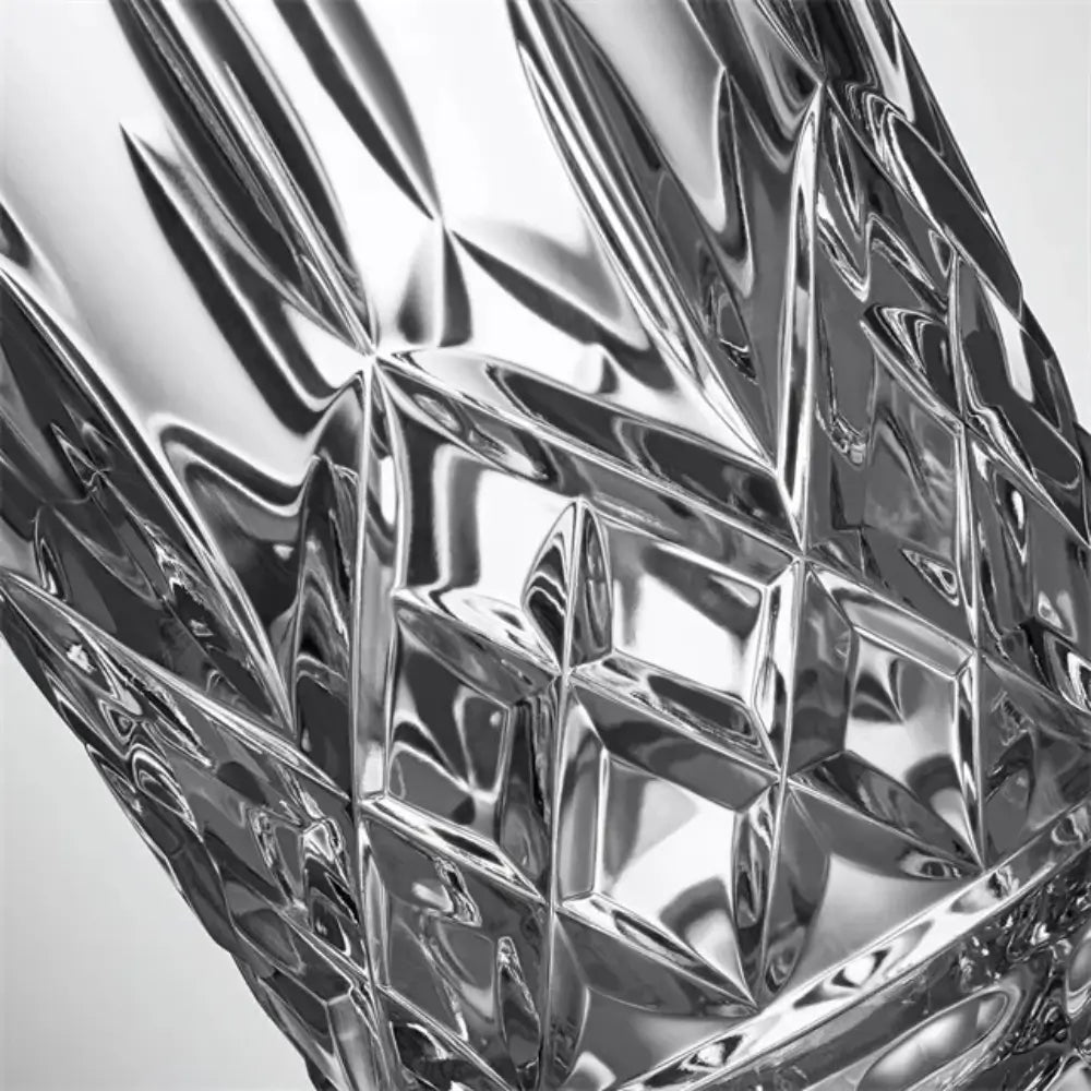 Close-up of a metallic, textured surface with diamond-like patterns.