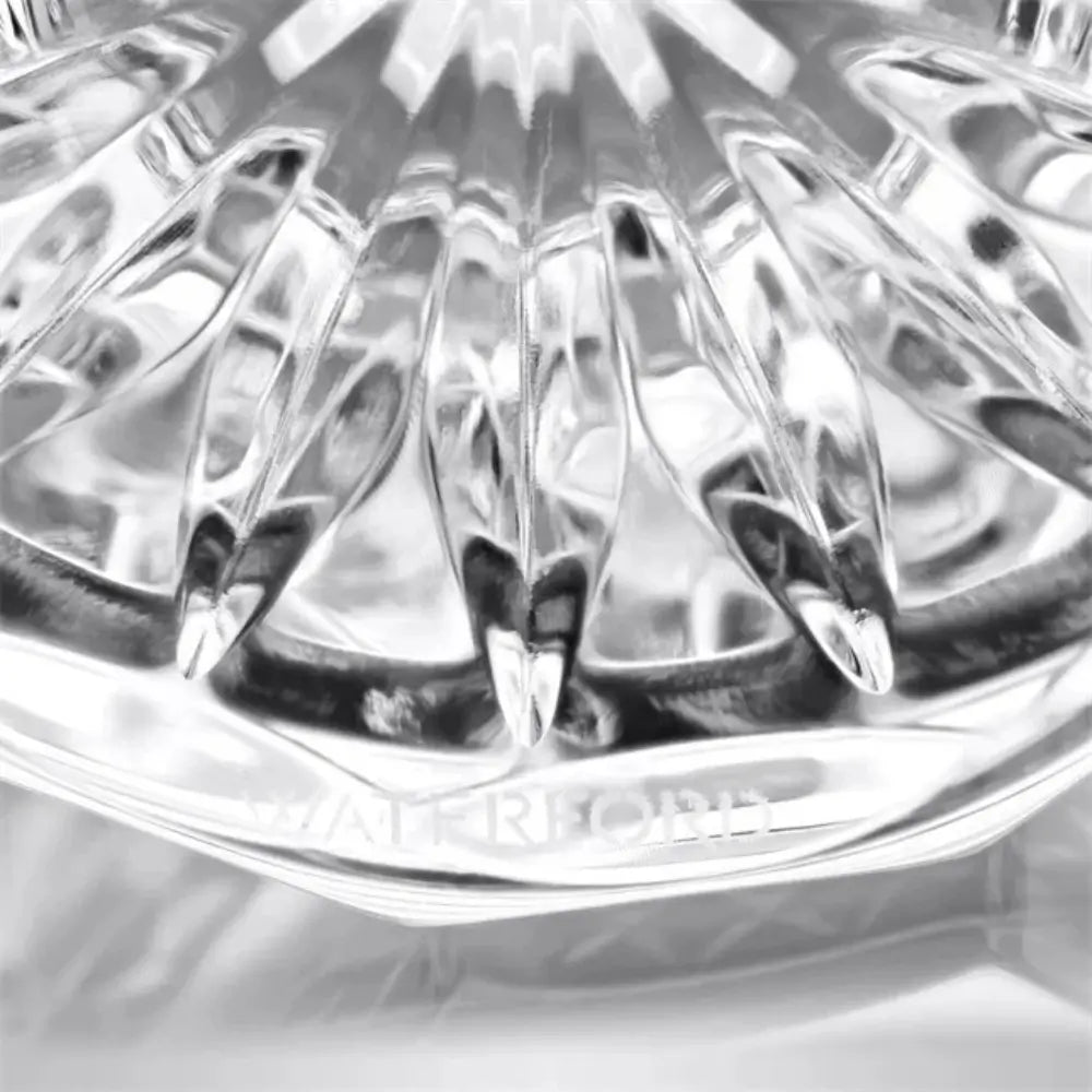 Close-up of a clear glass object with 'Himalayan' branding on a light gray background