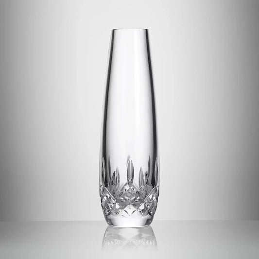 A clear crystal vase with a flared rim and a faceted cut pattern at the base, photographed on a light gray gradient background from our Waterford Crystal Australia collection 