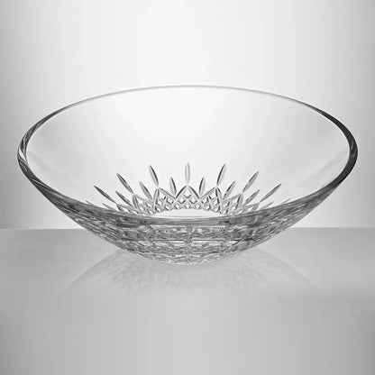 A clear cut-glass bowl with a decorative starburst pattern on the inside and a textured base from our Waterford Crystal Australia collection 
