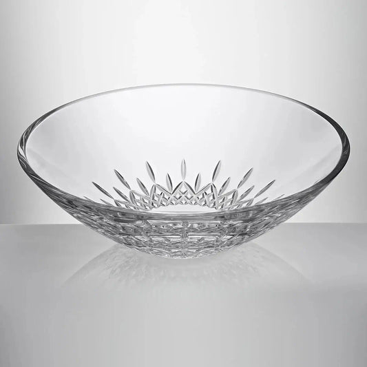 A clear cut-glass bowl with a decorative starburst pattern on the inside and a textured base from our Waterford Crystal Australia collection 