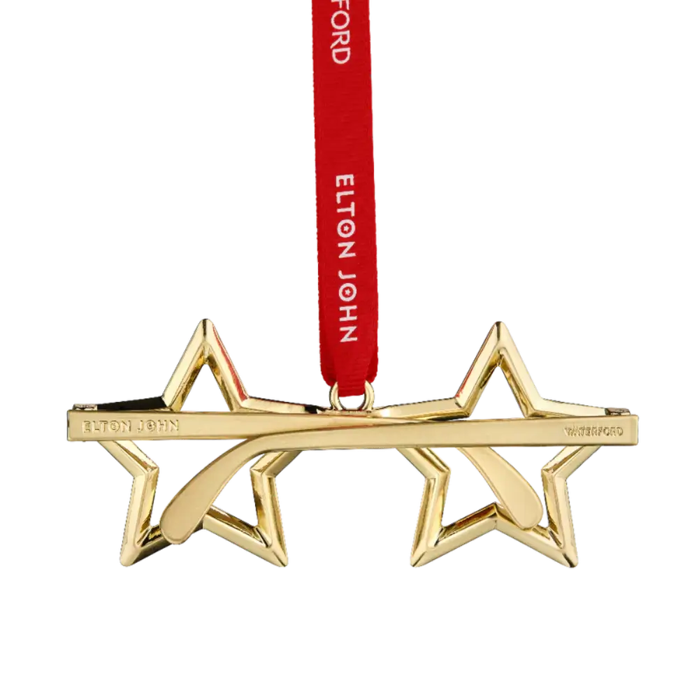 Gold star-shaped ornament with a red ribbon featuring 