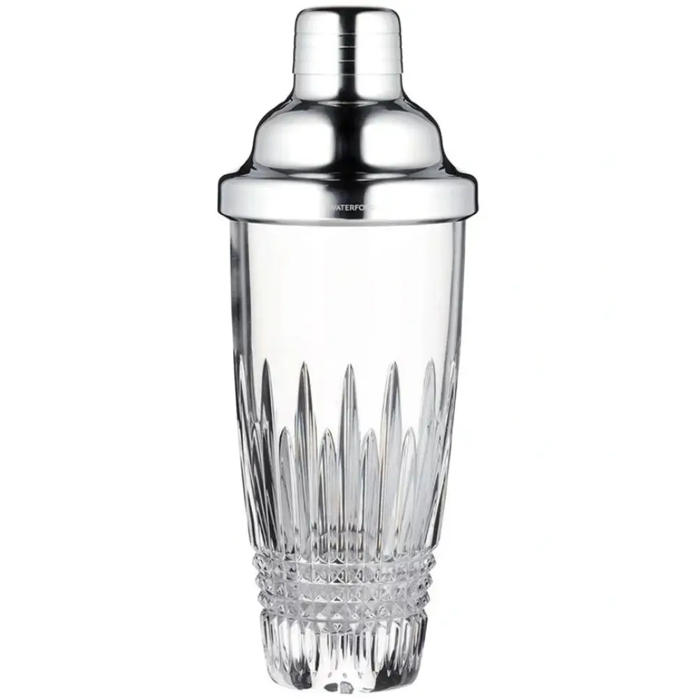 Cocktail shaker with clear glass body and silver top on a white background