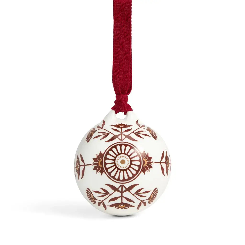 Decorative Christmas ball ornament with brown patterns on a white background