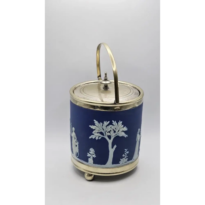 Decorative blue jar with white patterns and a gold lid