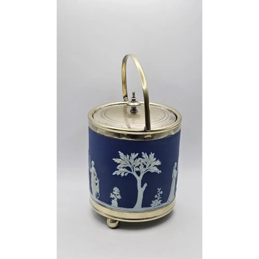 Decorative blue jar with white patterns and a gold lid