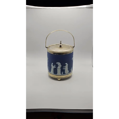 Decorative blue container with white figures 
