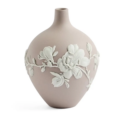 Ceramic vase with floral design on a white background