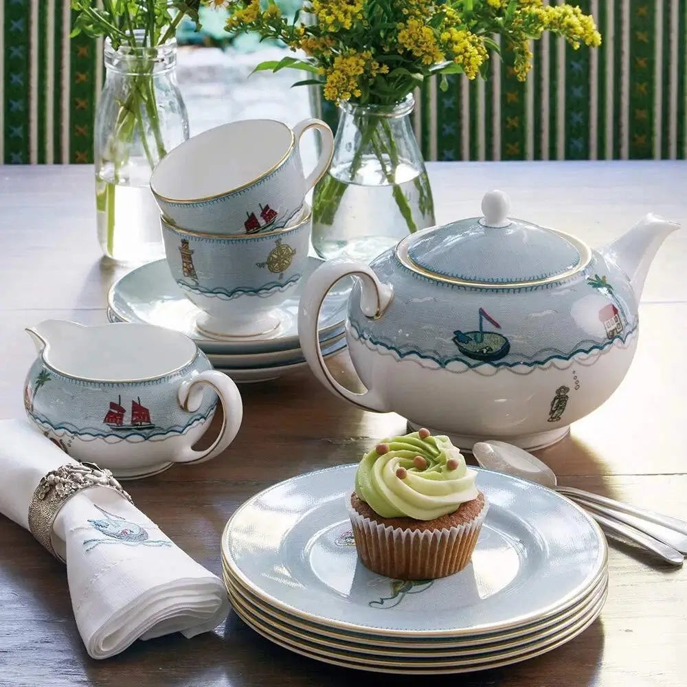 Luxury tea service featuring the Wedgwood Sailor's Farewell fine bone china teapot on a coastal-themed table.