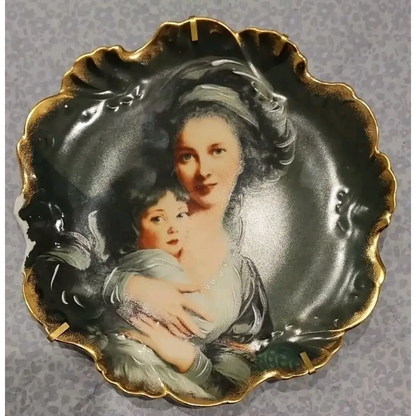 Decorative plate with a portrait of a woman and child 