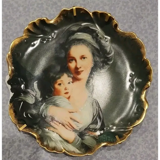 Decorative plate with a portrait of a woman and child 