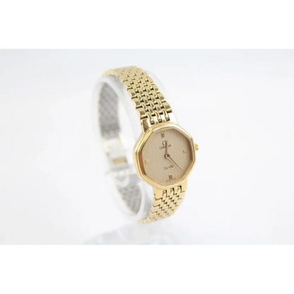Gold watch with a white background