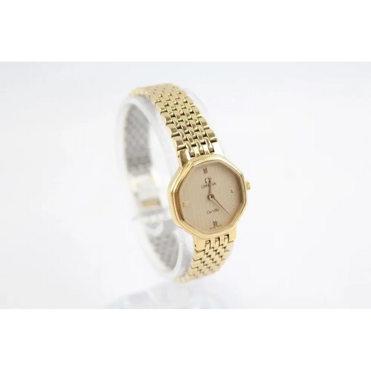 Gold watch with a white background