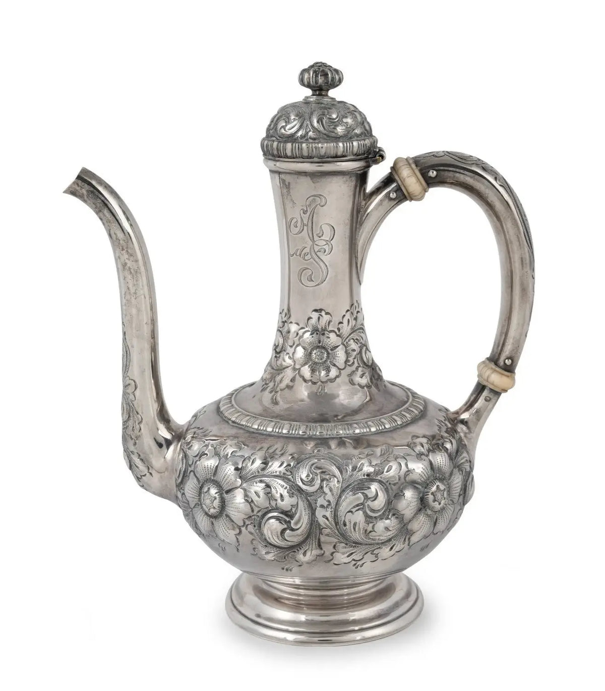 An ornate silver teapot with intricate floral and scrollwork embossed patterns, featuring a curved handle, a long spout, and a decorative lid, shown against a plain white background from our Antique & Vintage Collectibles Australia collection