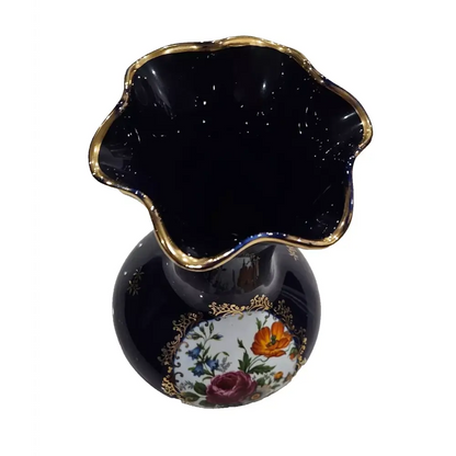 Black vase with floral design and gold accents 