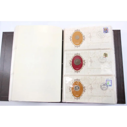 An open coin or collectible album binder showing several pages with postage-style stamps and circular coin inserts, photographed against a plain white background.