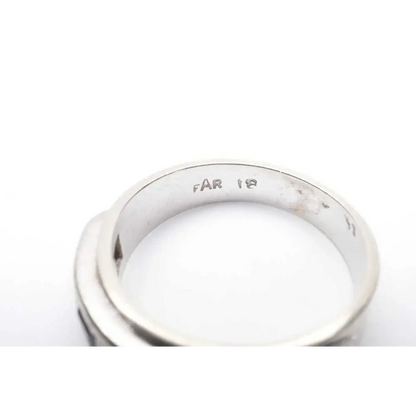 Silver ring with 'FAR 18' engraving on a white background