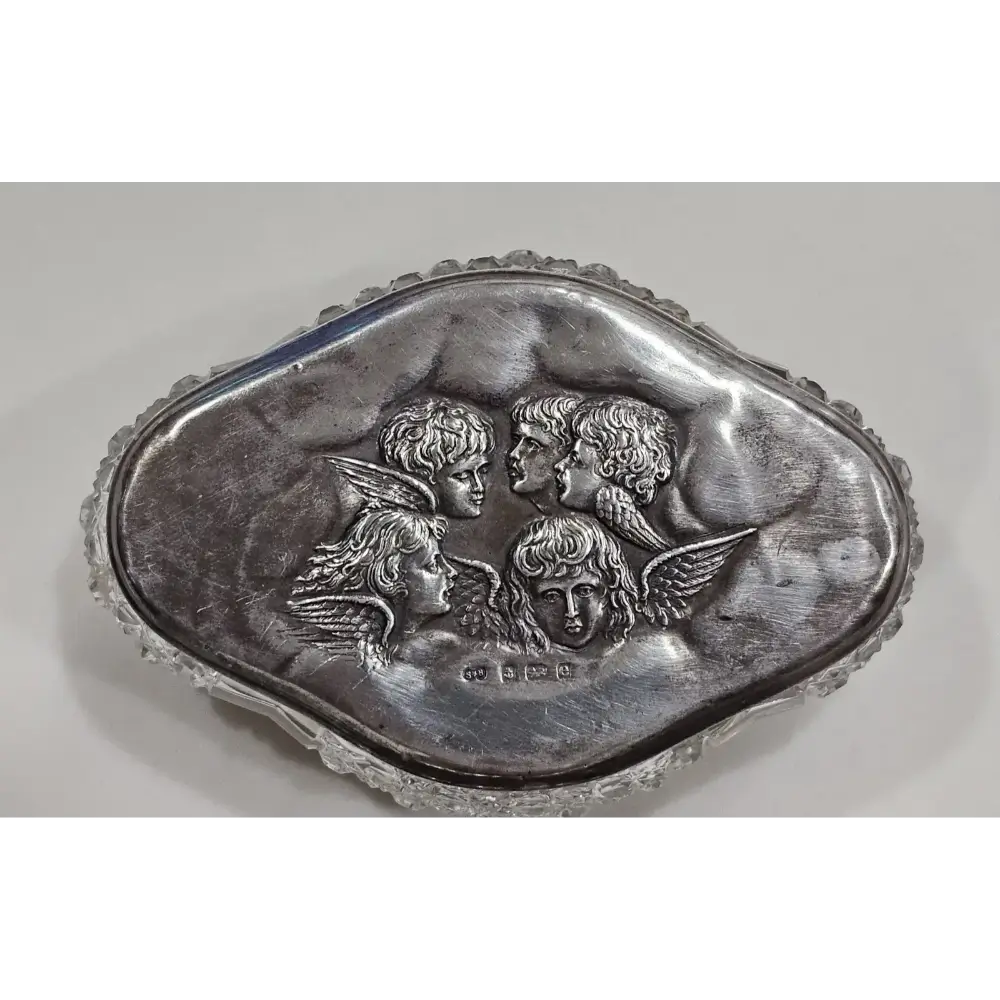 Decorative silver plate with angelic faces 