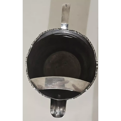 Silver coffee scoop with a black interior