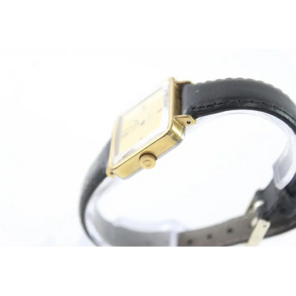 Gold-framed watch with black strap