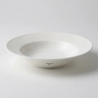 Top-down view of a Wedgwood Gio 20.5 cm pasta bowl, highlighting the shallow coupe shape and the signature geometric textured border.