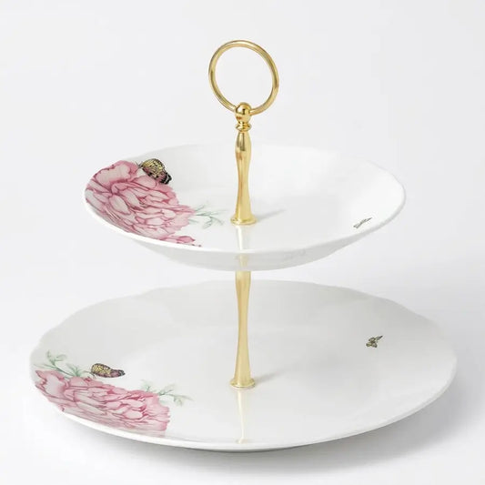 A two-tier ceramic serving stand with a gold-tone metal frame and handle, decorated with pink peony flowers and small butterflies on a white background from our Royal Albert Bone China Australia collection 