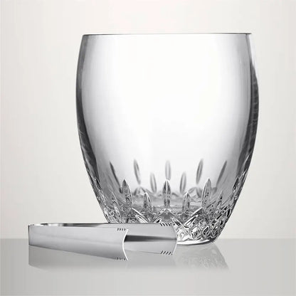 A clear cut-crystal tumbler glass with a matching silver-toned metal ice pick set, displayed on a reflective light gray surface against a neutral light gray background from our Waterford Crystal Australia – Outlet & Sale Collection